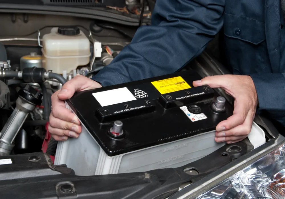 auto-mechanic-replacing-car-battery-2023-11-27-05-35-25-utc